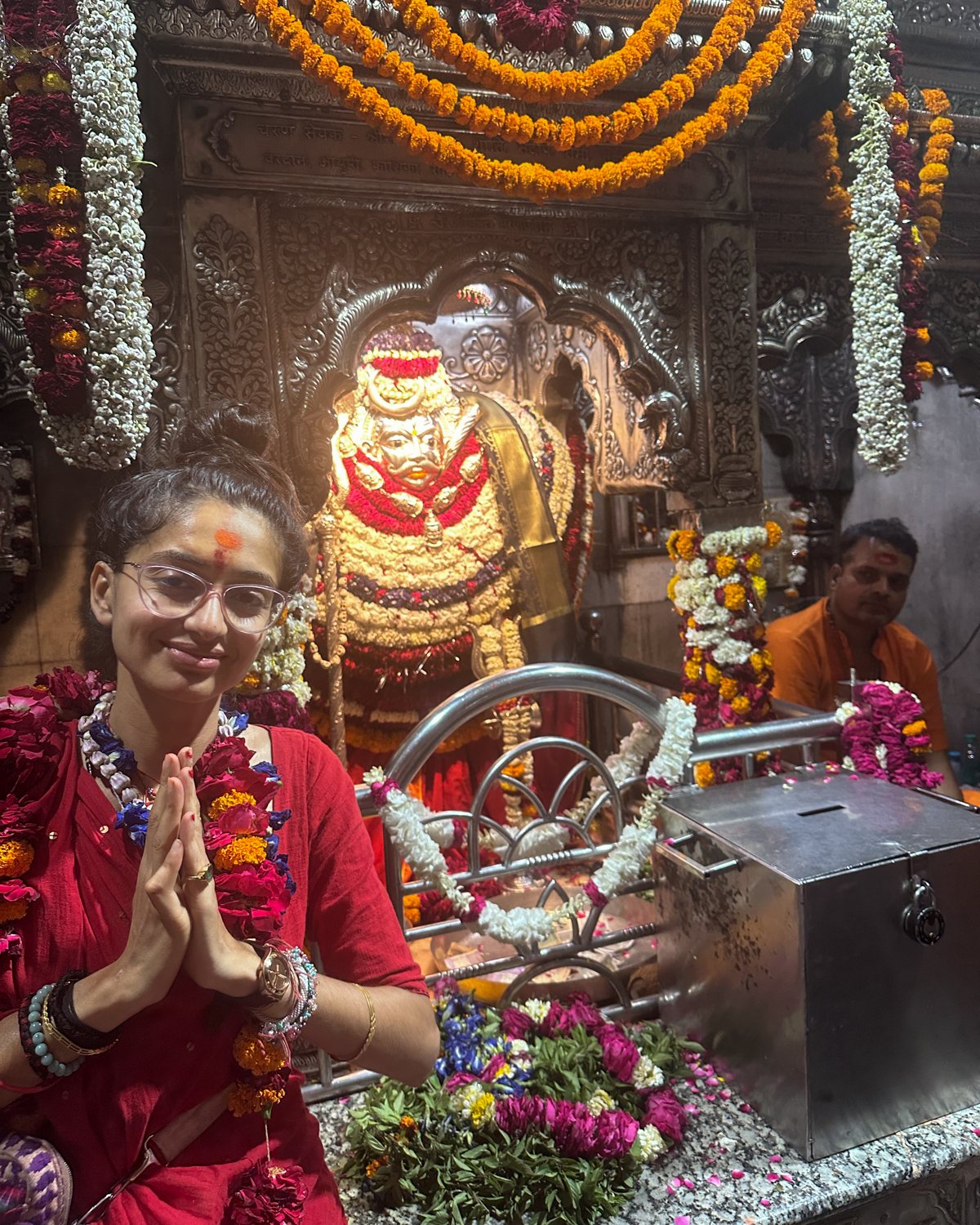 Kamya in namaste before Kāla Bhairava